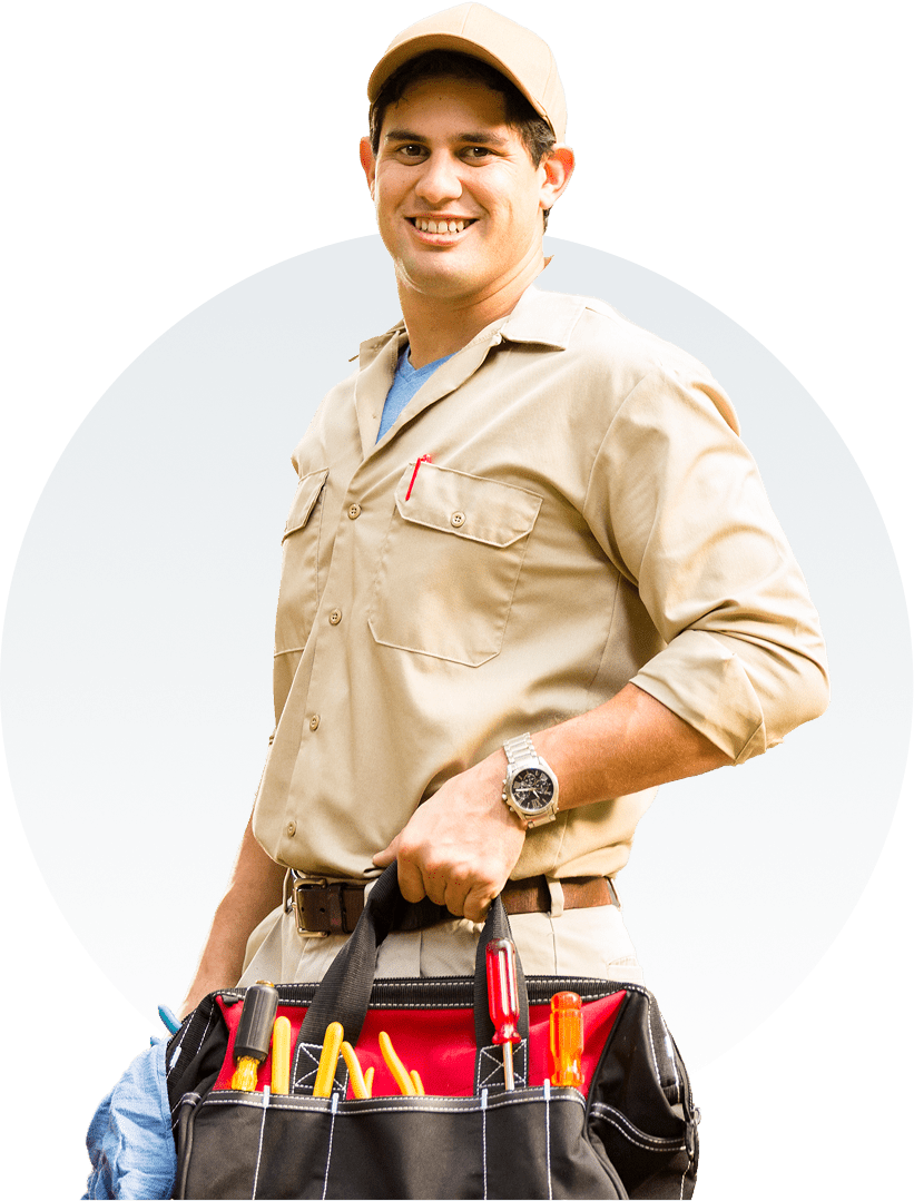 Group 1321317155 A person in a beige work uniform and cap holds a black tool bag with various tools.